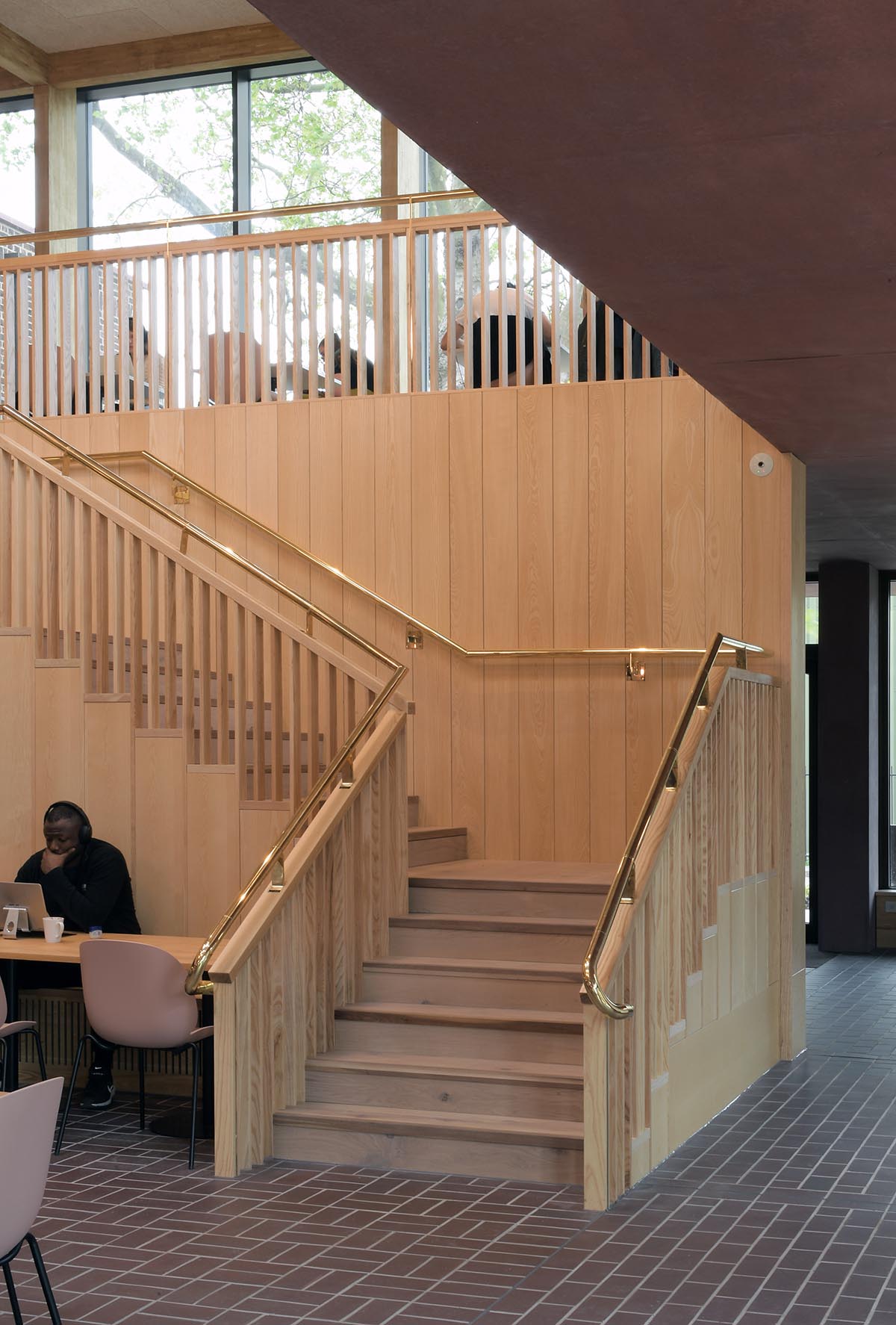 Brown brindle quarry tiles in the new building at Homerton College Cambridge in various laying patterns images by David Grandorge